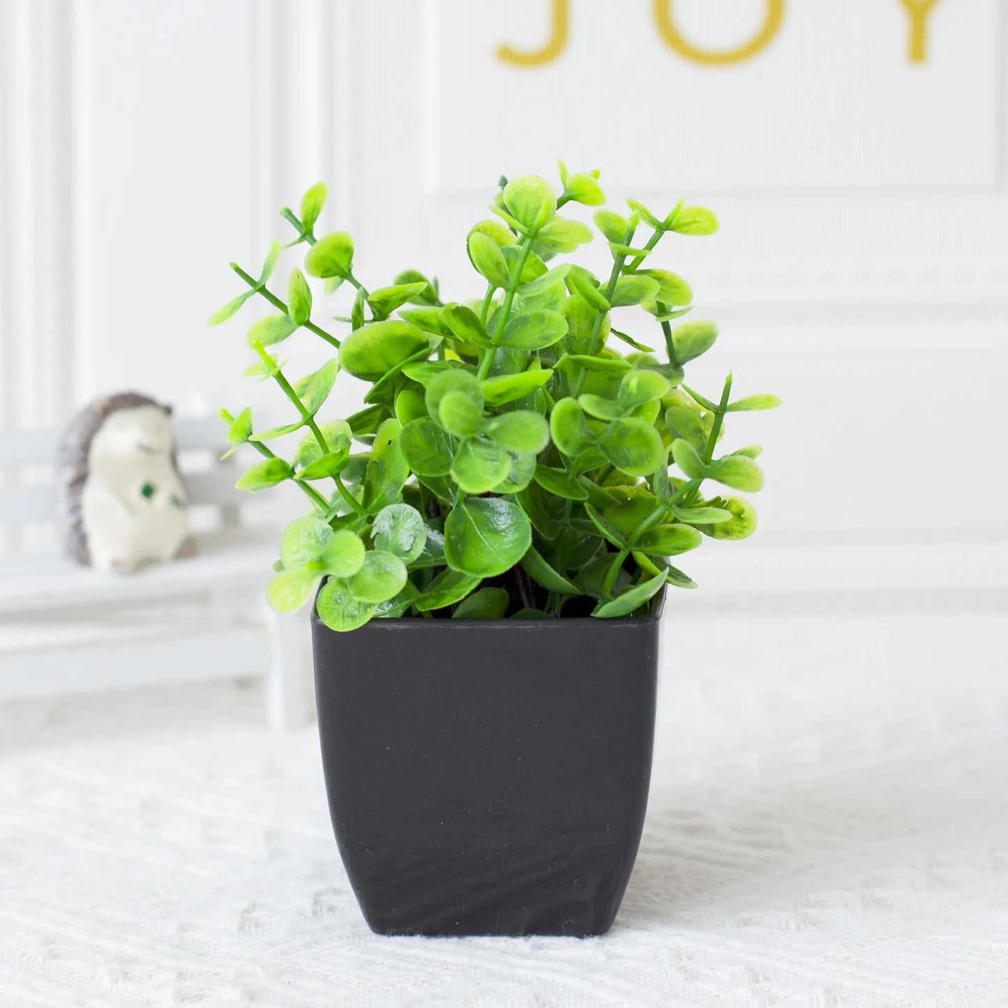 One Fake Plant Black Pot